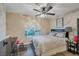 Charming bedroom featuring a ceiling fan and a sunlit window at 3125 N Buffalo Dr # 1089, Las Vegas, NV 89128
