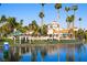 Resort-style community pool with palm trees and seating areas at 3125 N Buffalo Dr # 1089, Las Vegas, NV 89128