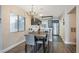 Bright dining area with chandelier and seating for four at 3125 N Buffalo Dr # 1089, Las Vegas, NV 89128