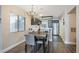Charming dining area with chandelier, table for four, and view of the kitchen at 3125 N Buffalo Dr # 1089, Las Vegas, NV 89128