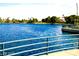 Serene view of a community lake with walking path at 3125 N Buffalo Dr # 1089, Las Vegas, NV 89128