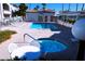 Community pool and spa with lounge chairs and patio furniture at 3125 N Buffalo Dr # 1089, Las Vegas, NV 89128