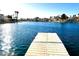 Picturesque waterfront view from the dock featuring calm waters, waterfront homes, and beautiful palm trees at 3125 N Buffalo Dr # 1089, Las Vegas, NV 89128