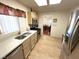 Open kitchen with stainless steel appliances and view into dining area at 10065 Hemet Dr, Las Vegas, NV 89134