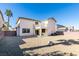 Backyard with gravel, block wall, and home view at 26 Drawback St, Henderson, NV 89012