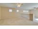 Spacious loft area with high ceilings and two ceiling fans at 26 Drawback St, Henderson, NV 89012