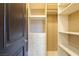 Spacious walk-in closet offers custom shelving and drawers for storage at 33 Promontory Ridge Dr, Las Vegas, NV 89135
