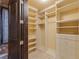Large walk-in closet with shelving and drawers at 33 Promontory Ridge Dr, Las Vegas, NV 89135