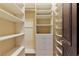 Large walk-in closet with built-in shelves and drawers at 33 Promontory Ridge Dr, Las Vegas, NV 89135