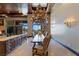 Open dining area with a large table and a view of the pool at 33 Promontory Ridge Dr, Las Vegas, NV 89135