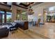 Grand dining area with a large chandelier and views to the backyard at 33 Promontory Ridge Dr, Las Vegas, NV 89135