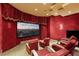 Home theater with plush seating and large screen at 33 Promontory Ridge Dr, Las Vegas, NV 89135
