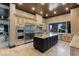 Gourmet kitchen boasts stainless steel appliances and granite countertops at 33 Promontory Ridge Dr, Las Vegas, NV 89135