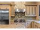Modern kitchen features granite countertops and custom cabinetry at 33 Promontory Ridge Dr, Las Vegas, NV 89135