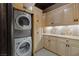 Laundry room with stacked washer and dryer at 33 Promontory Ridge Dr, Las Vegas, NV 89135