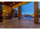 Covered patio with pool and landscape views at 33 Promontory Ridge Dr, Las Vegas, NV 89135