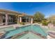 Resort-style pool with spa and waterfall feature at 33 Promontory Ridge Dr, Las Vegas, NV 89135