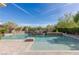 Inviting pool with waterfall feature and spacious deck at 33 Promontory Ridge Dr, Las Vegas, NV 89135