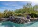 Stunning pool and spa with a cascading waterfall at 33 Promontory Ridge Dr, Las Vegas, NV 89135