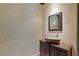 Elegant powder room with stone sink and mosaic tile at 33 Promontory Ridge Dr, Las Vegas, NV 89135
