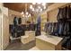 Large walk-in Primary closet with ample hanging space and shelving at 33 Promontory Ridge Dr, Las Vegas, NV 89135
