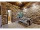 Relaxing recreation room with stone wall and comfortable seating at 33 Promontory Ridge Dr, Las Vegas, NV 89135