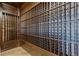 Extensive wine cellar with custom wooden racking at 33 Promontory Ridge Dr, Las Vegas, NV 89135