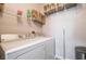 Convenient laundry room with washer, dryer, and shelving at 7147 S Durango Dr # 302, Las Vegas, NV 89113