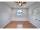 Well-lit bedroom featuring hardwood floors and a ceiling fan at 4 Kennesaw Rd, Henderson, NV 89052