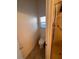 Compact bathroom features a step-in shower, toilet, and small window for natural light at 5025 Vista Loma Way, North Las Vegas, NV 89031