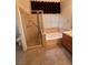 Bathroom features a shower, a bathtub, and a single sink at 5025 Vista Loma Way, North Las Vegas, NV 89031
