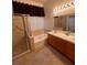 Well-lit bathroom featuring a shower, separate soaking tub, and double sink vanity at 5025 Vista Loma Way, North Las Vegas, NV 89031