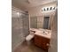 Functional bathroom featuring a glass enclosed shower, toilet, and vanity with sink at 5025 Vista Loma Way, North Las Vegas, NV 89031