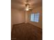 Neutral bedroom features plush carpeting, ceiling fan, and a window for natural light at 5025 Vista Loma Way, North Las Vegas, NV 89031