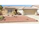 One-story house with desert landscaping and a two-car garage at 5025 Vista Loma Way, North Las Vegas, NV 89031