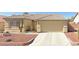 One-story house with desert landscaping and a two-car garage at 5025 Vista Loma Way, North Las Vegas, NV 89031