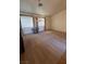 Bright and spacious room with carpet, large windows, a decorative light fixture, and neutral colored walls at 5025 Vista Loma Way, North Las Vegas, NV 89031