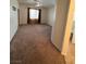 Spacious living room featuring neutral walls, plush carpet, and an airy atmosphere at 5025 Vista Loma Way, North Las Vegas, NV 89031