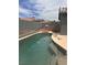 Backyard pool with a tanning ledge and a waterfall feature at 5025 Vista Loma Way, North Las Vegas, NV 89031