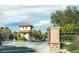 Gated community entrance with guard house at 7877 Campers Village Ave, Las Vegas, NV 89178