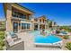 Relaxing poolside view with lounge chairs and a spacious patio at 4 Olympia Chase Dr, Las Vegas, NV 89141