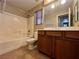 Bathroom with a tub/shower combination and a wood vanity cabinet at 7961 Alta Lima Valley Ct, Las Vegas, NV 89178
