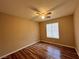 This bedroom features a ceiling fan and a window for natural light at 7961 Alta Lima Valley Ct, Las Vegas, NV 89178