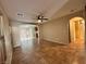 Open-concept living room with tile flooring that transitions to a kitchen at 7961 Alta Lima Valley Ct, Las Vegas, NV 89178