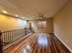 Spacious loft area with wood flooring and natural light from window at 7961 Alta Lima Valley Ct, Las Vegas, NV 89178