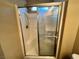 A shower stall features a glass sliding door and a shower head at 7961 Alta Lima Valley Ct, Las Vegas, NV 89178
