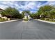 Street view showcasing the well-maintained road and landscaping within the community at 7961 Alta Lima Valley Ct, Las Vegas, NV 89178