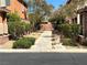 Community walkway with desert landscaping and shrubbery lined pathway, offering pedestrian access and curb appeal at 7961 Alta Lima Valley Ct, Las Vegas, NV 89178
