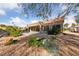 Scenic backyard featuring desert landscaping with a covered patio, ideal for enjoying the outdoors at 8517 Bayland Dr, Las Vegas, NV 89134
