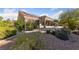 Expansive backyard with mature landscaping and a covered patio perfect for outdoor entertaining and relaxing at 8517 Bayland Dr, Las Vegas, NV 89134